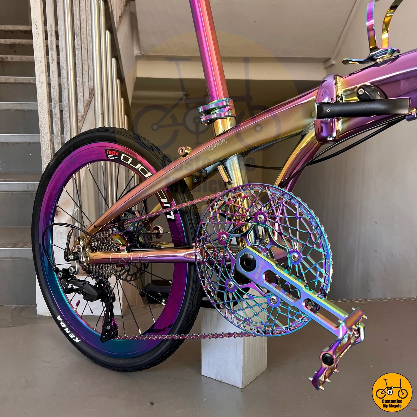 Stylish folding bicycle featuring a futuristic oil slick chainring