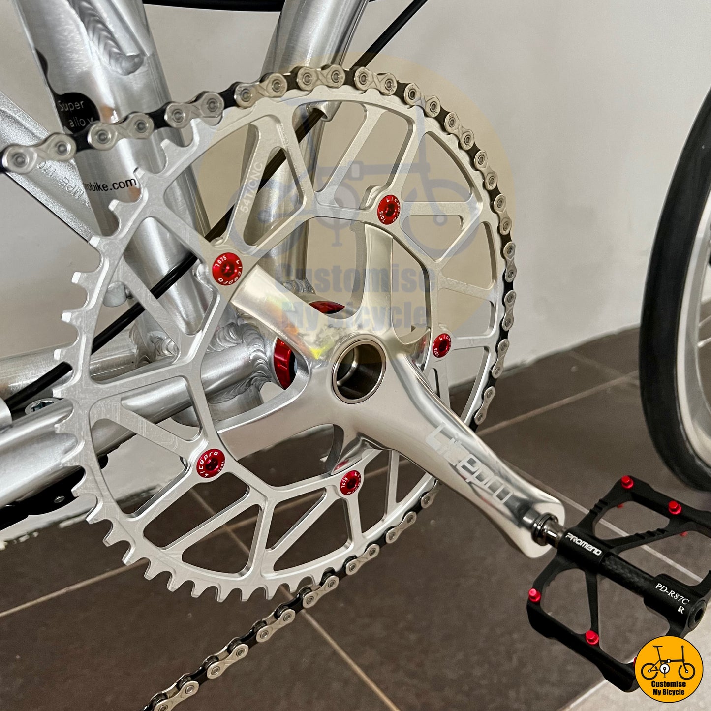 Lightweight alloy crankset with a silver finish for efficient pedaling