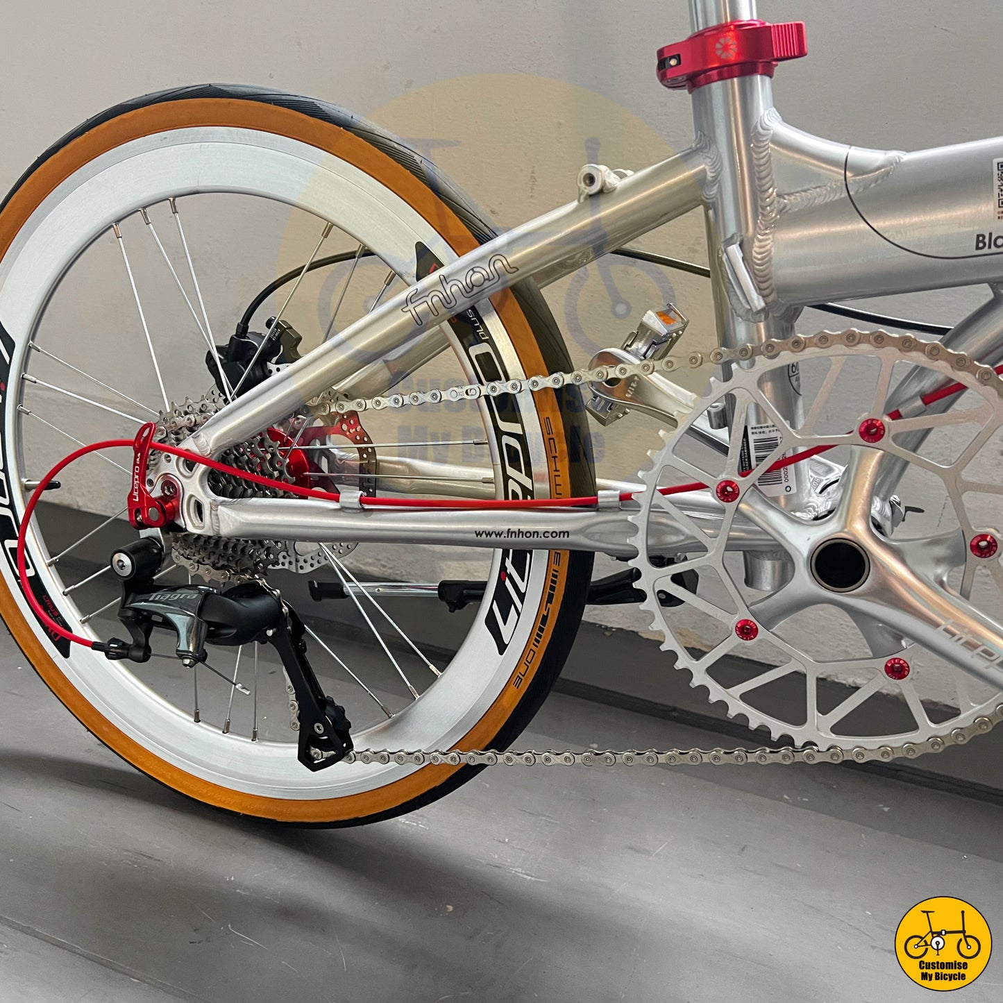 Litepro hollow chainring & red seat post clamp on Polished Silver Fnhon Blast 22-Inch Folding Bike β Inspired by Sci-Fi Aesthetics