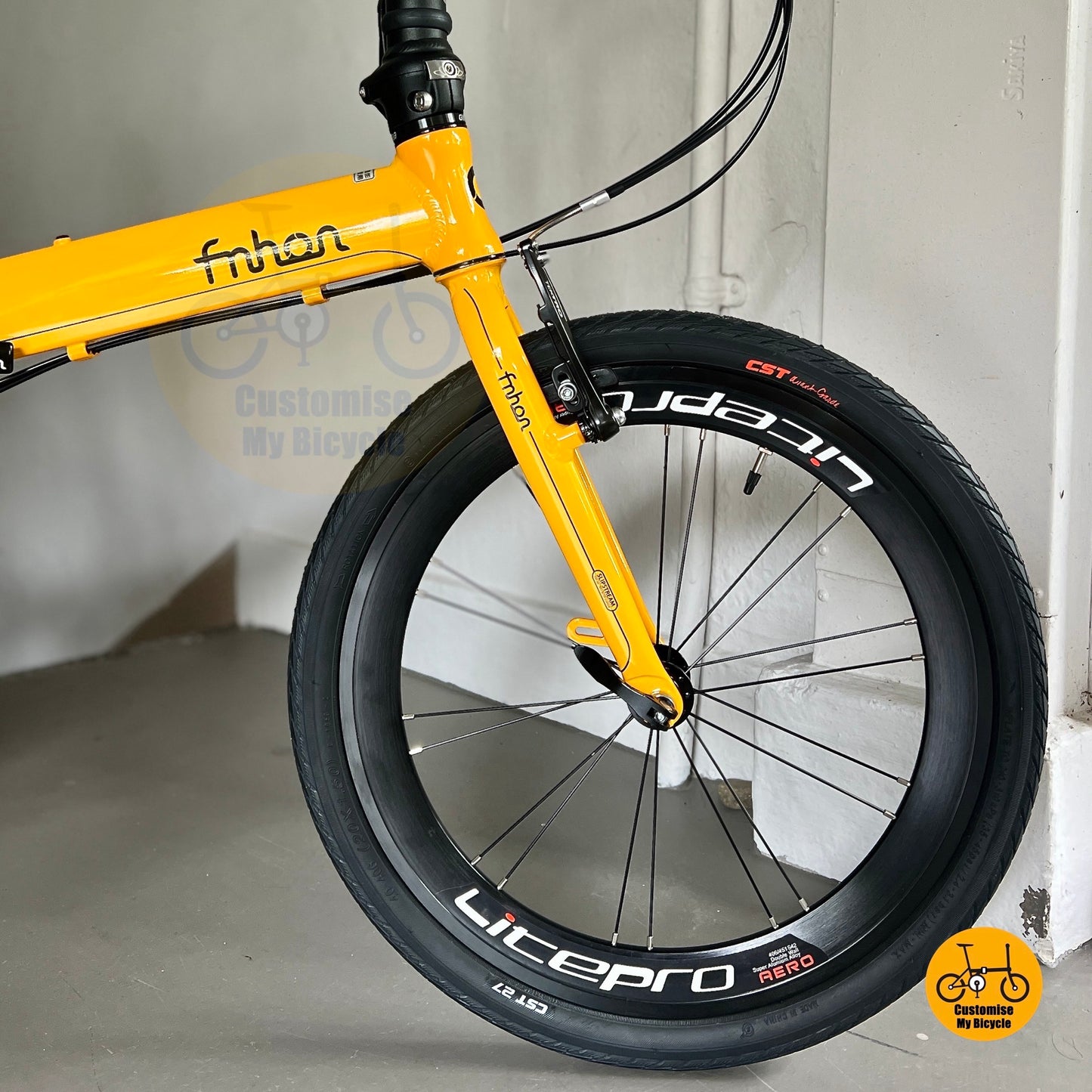 Golden yellow frame with CST city black tyres