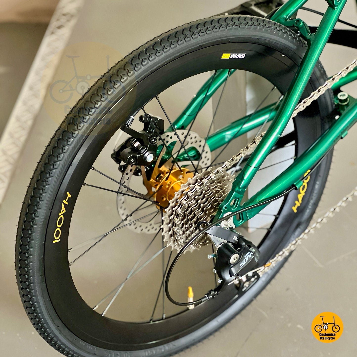 Close up of Shimano 9 speed gear system on Fnhon Monsoon Emerald Green Gold folding bike