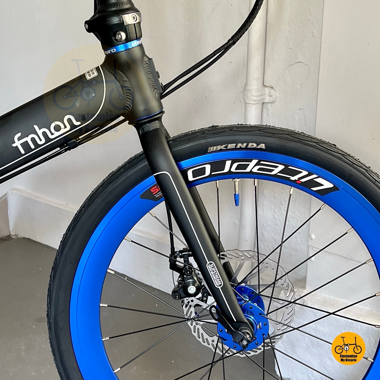 Close up of Litepro Aero high profile front wheel on Fnhon Monsoon Matte Black Blue