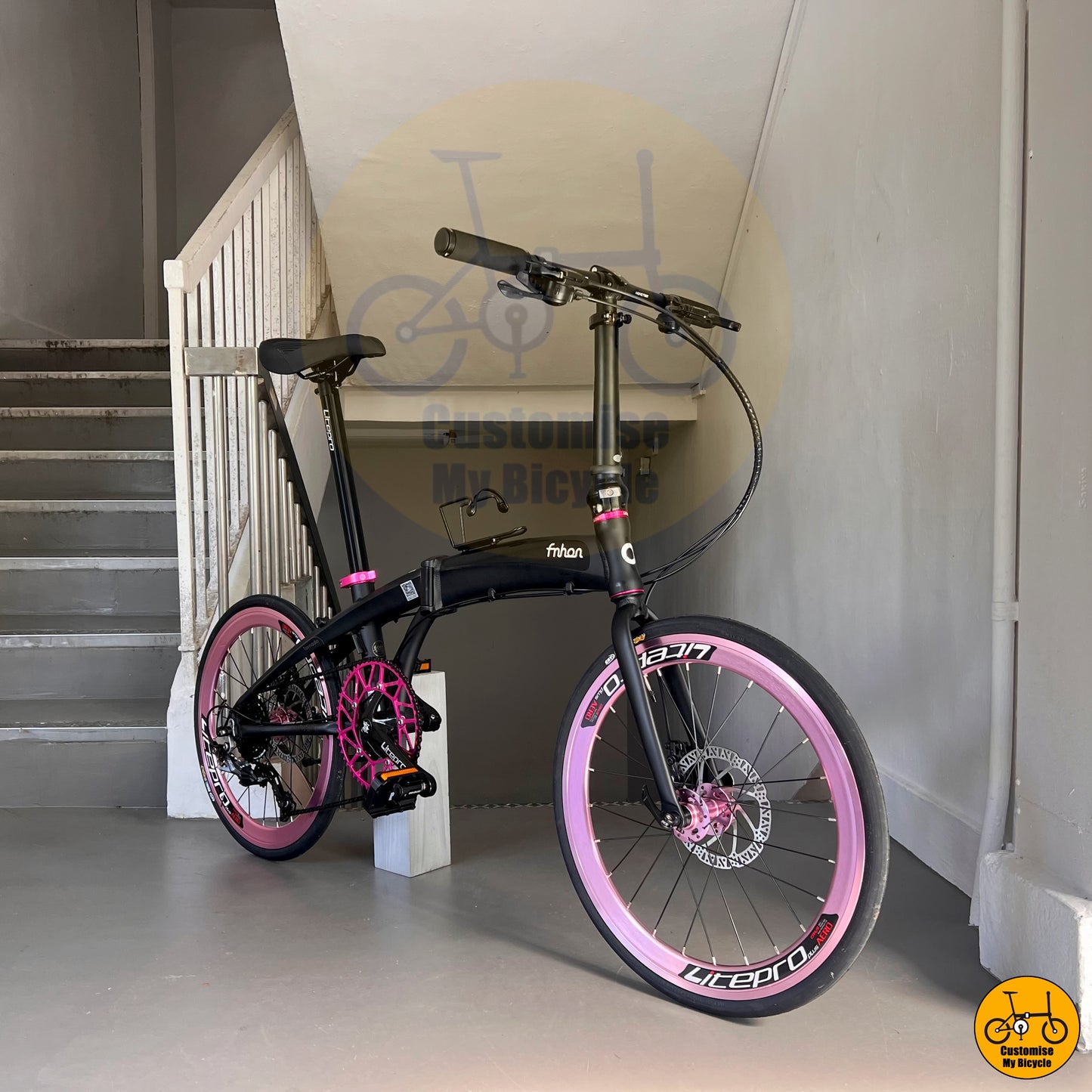 Elegant & Stylish Foldie β Baby Pink Wheels on a Sleek Matte Black Frame
