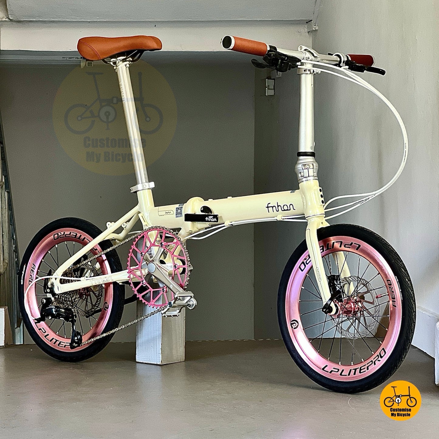Lower front angle of Fnhon Zephyr 18 inch beige folding bicycle with CST tyres