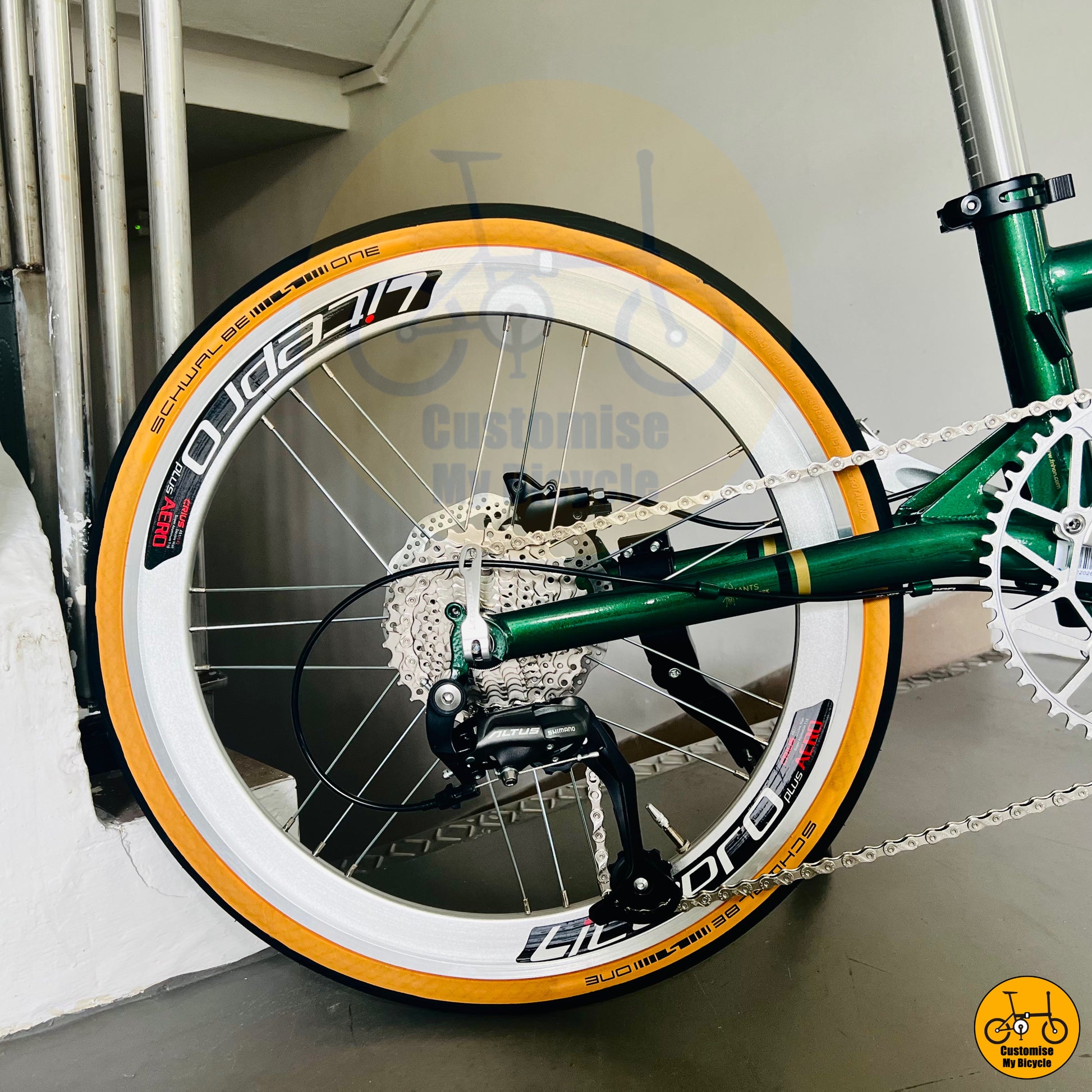 Silver wall Litepro wheels on a 22-inch folding bicycle for smooth city rides
