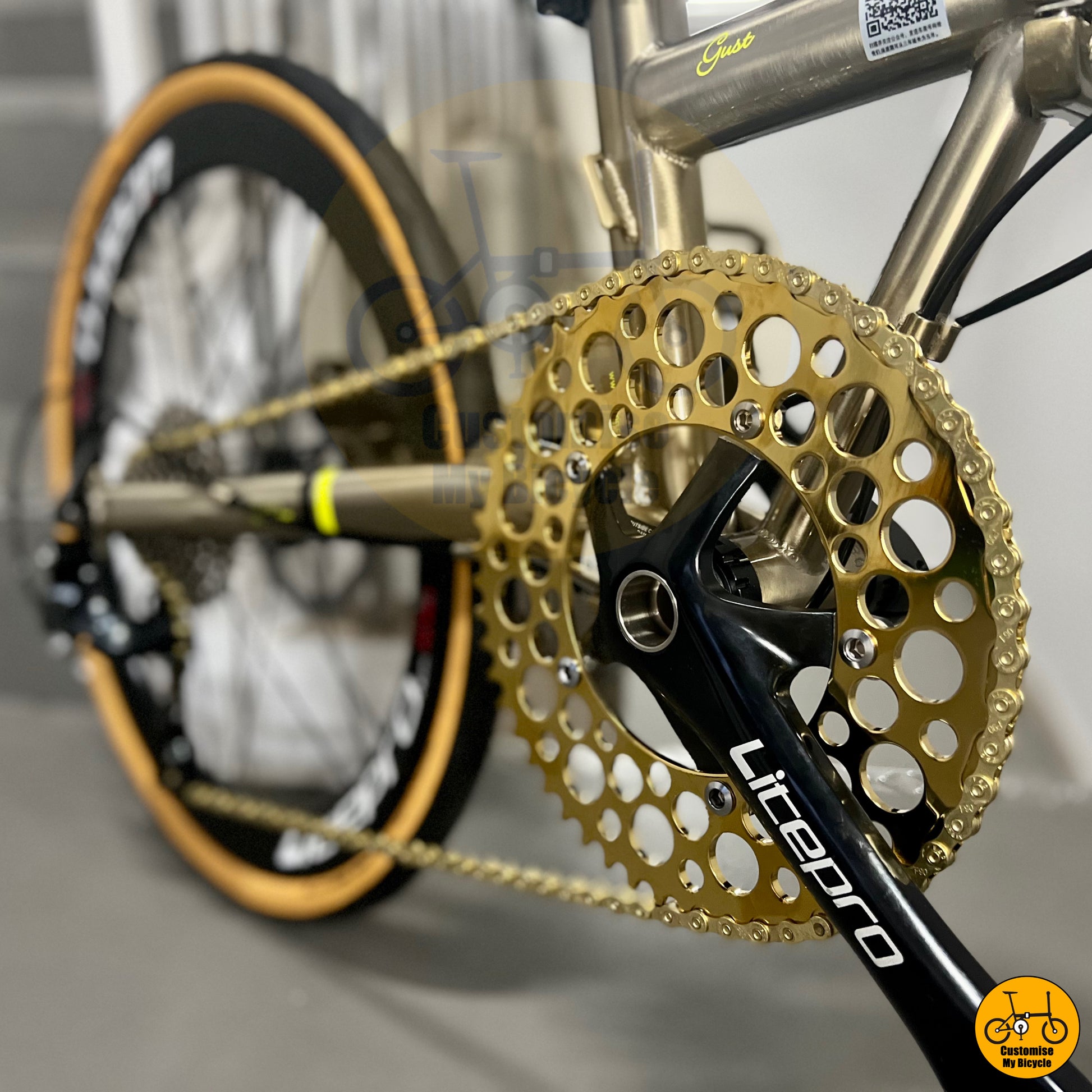 Folding bike featuring a titanium gold chainring for a luxurious touch
